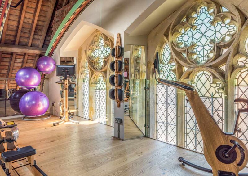 Interior of gym with stained glass windows. An award-winning construction project by Kent Structures