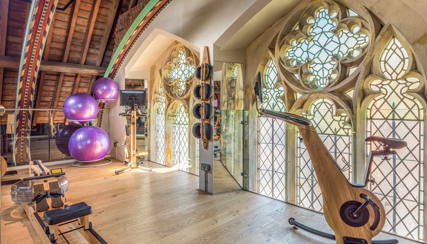 Interior of gym with stained glass windows. An award-winning construction project by Kent Structures