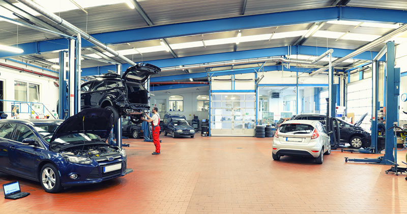 Interior of steel frame commercial Automotive garage in operation.