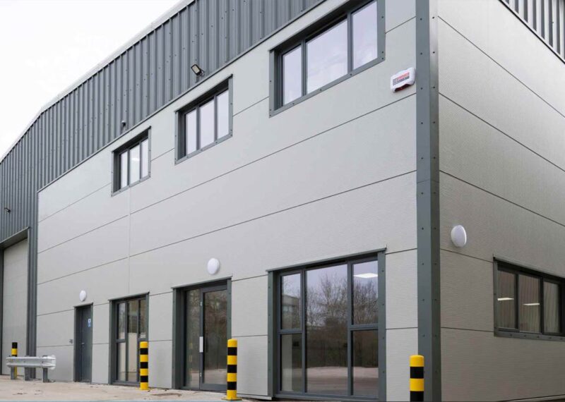 News image of modern Opak Ltd warehouse building with grey metal cladding.